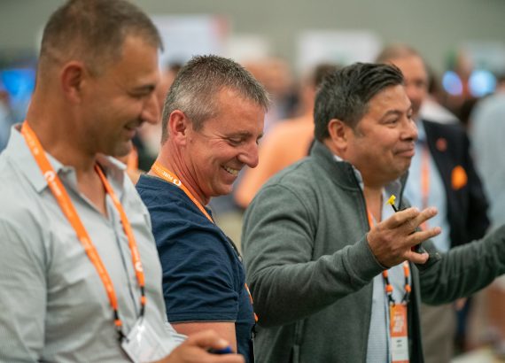 Attendees having fun at the RC race track on the Expo floor