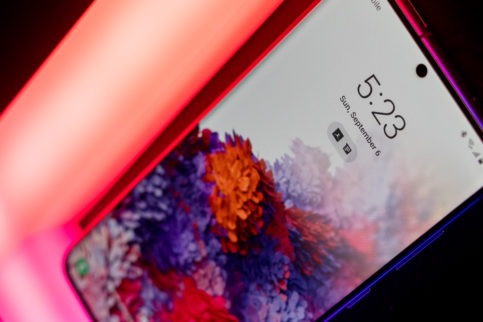 Galaxy S20 sitting on a neon colored light.