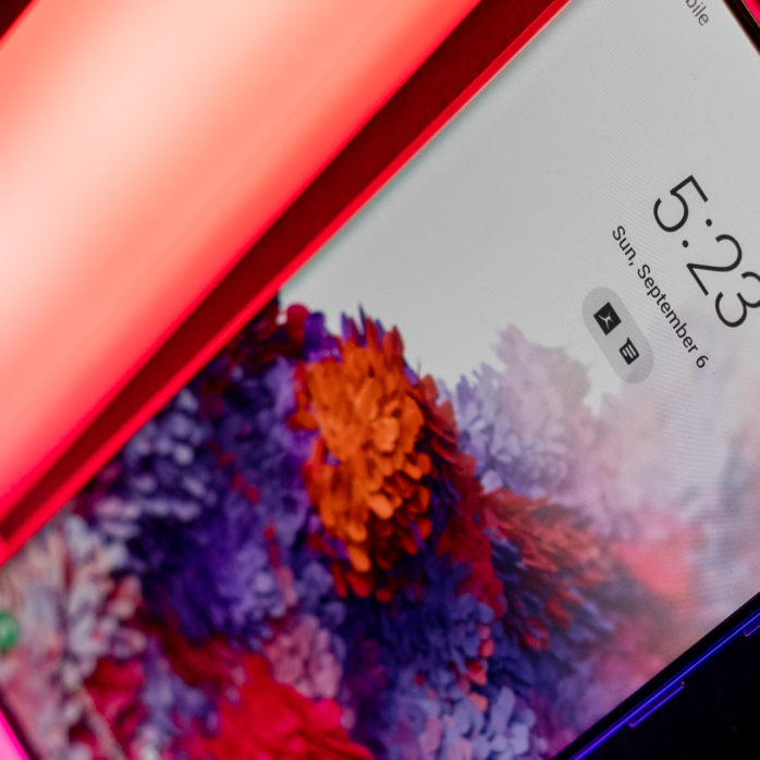 Galaxy S20 sitting on a neon colored light.