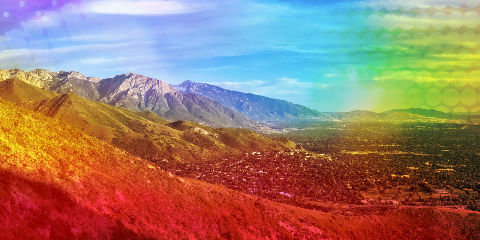 Panoramic view of the Salt Lake Valley with rainbow Pride gradient overlay
